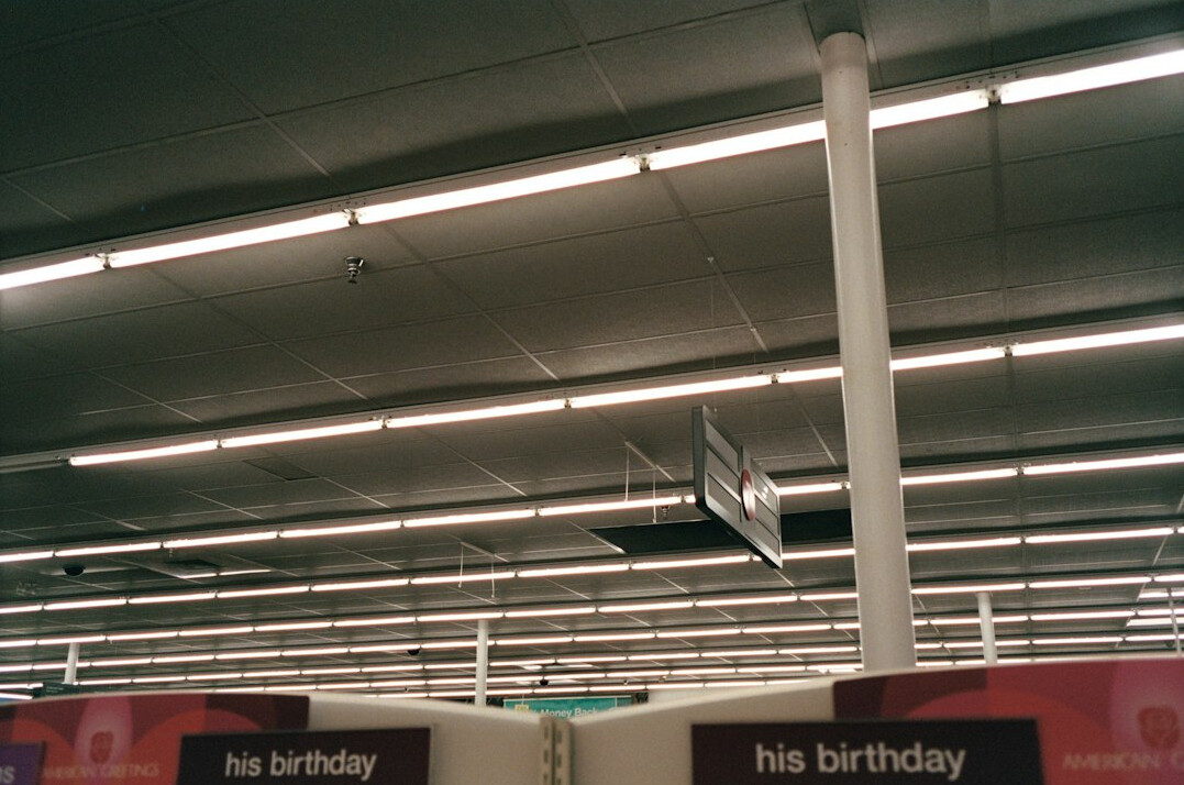 Retail store interior with clothing racks and wide walkways