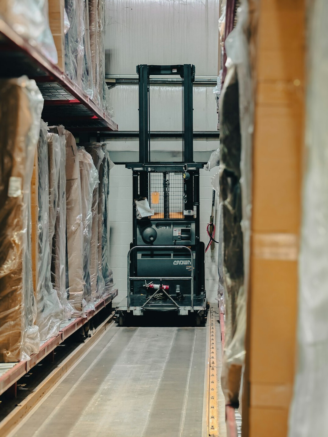 Warehouse shelves with stacked boxes and pallets